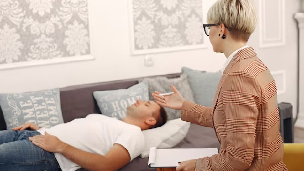 Patient lying on sofa in hypnosis session