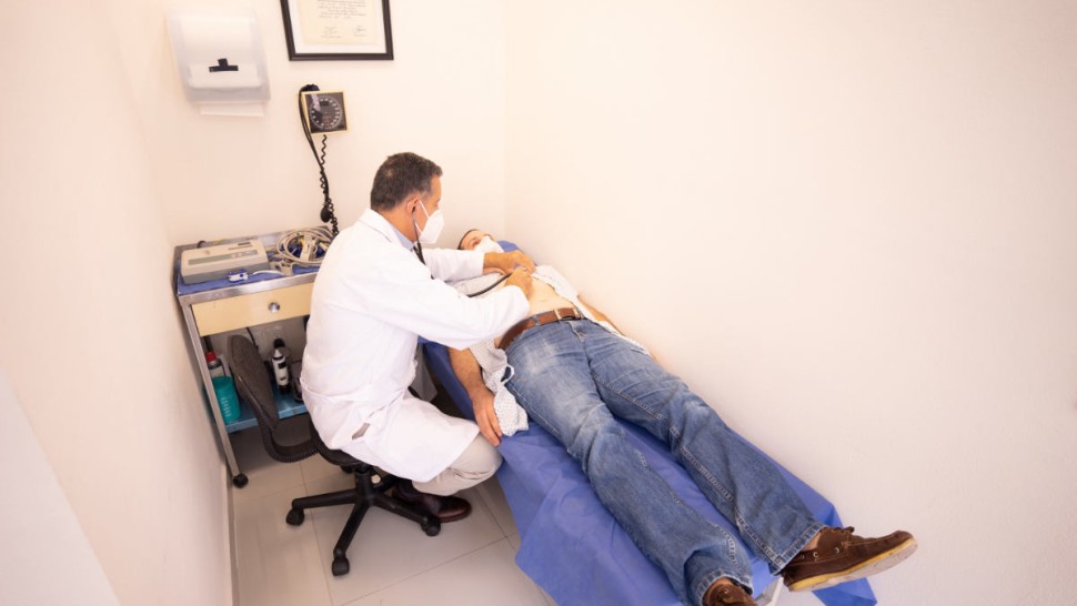 Patient in consultation with his doctor