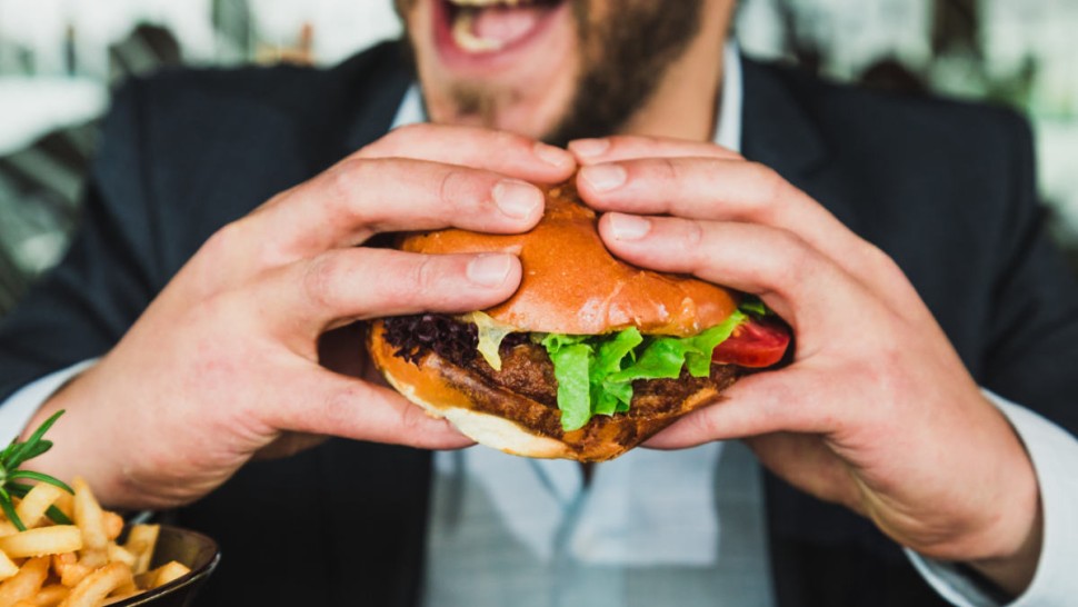 A man eating a burger