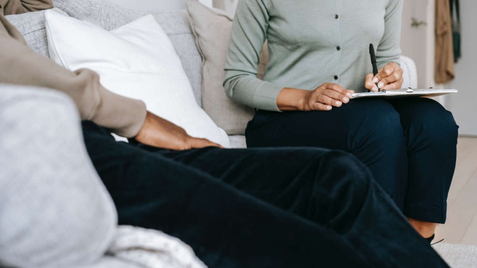 A patient and a coach in a therapy session