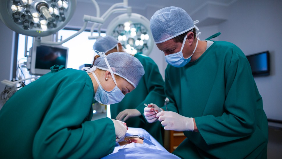 surgeons performing operation in an operation theater