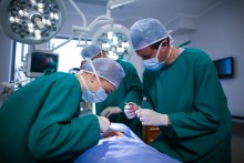 surgeons performing operation in an operation theater
