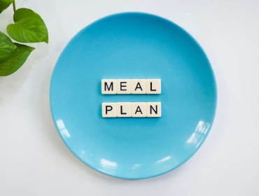 Meal Plan written in Scrabble word on a plate