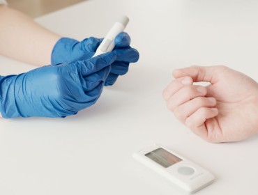 Patient taking a blood sugar test