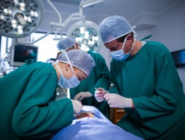 surgeons performing operation in an operation theater